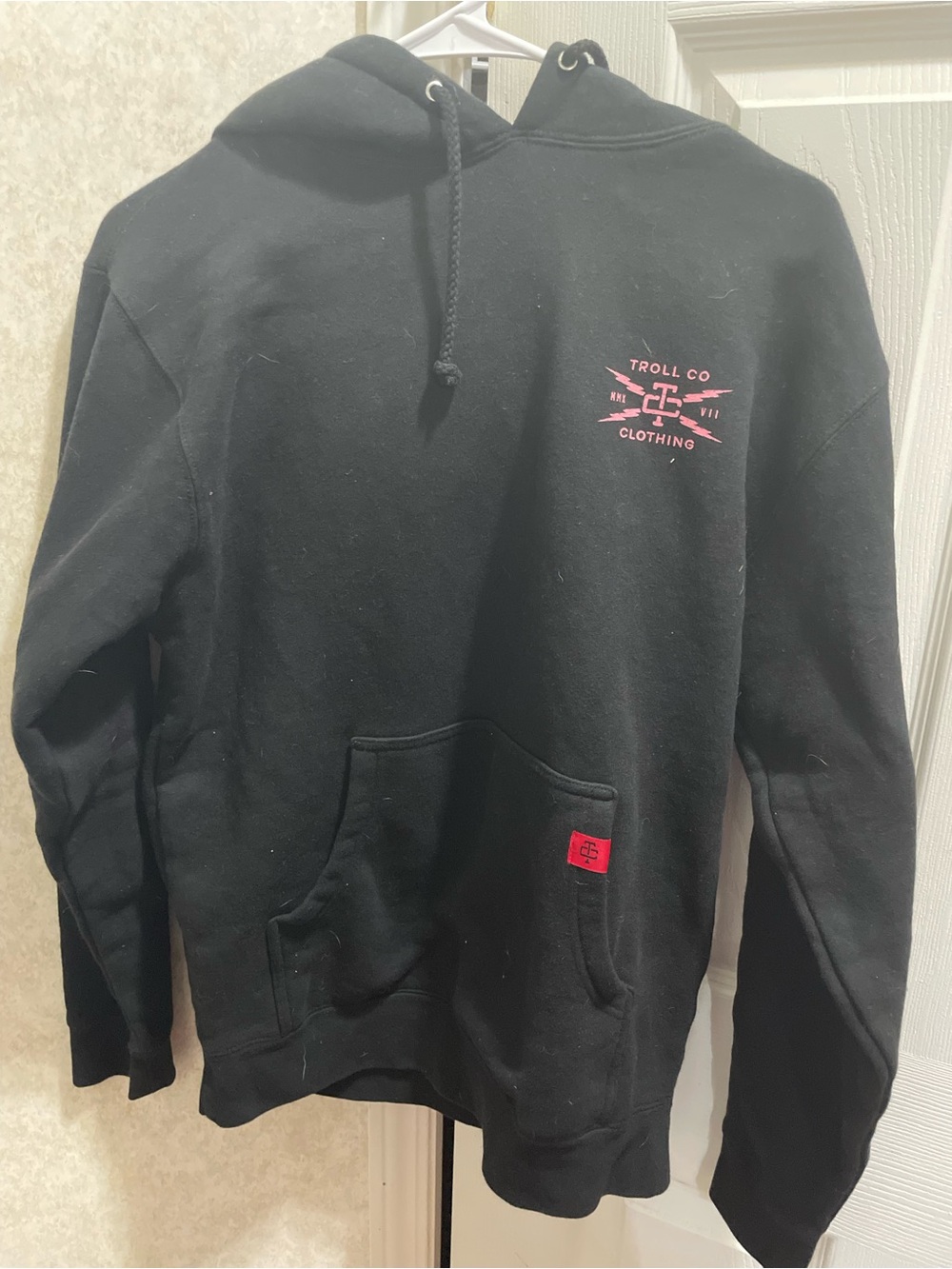 Trolls Black Hoodie with Pink Chest Logo